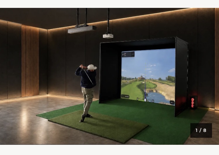 Complete RSG Pro Studio installation with enclosure, impact screen, hitting mat, overhead launch monitor, projector and software visible